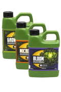 Emerald Harvest Grow Micro Bloom 500 ml – yan yana duran yeşil, turuncu ve mor etiketli üç koyu yeşil şişe