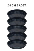 Grow Wizard 30 cm yuvarlak saksı altlığı 5 adet – beş adet siyah yuvarlak altlığın toplu görünümü