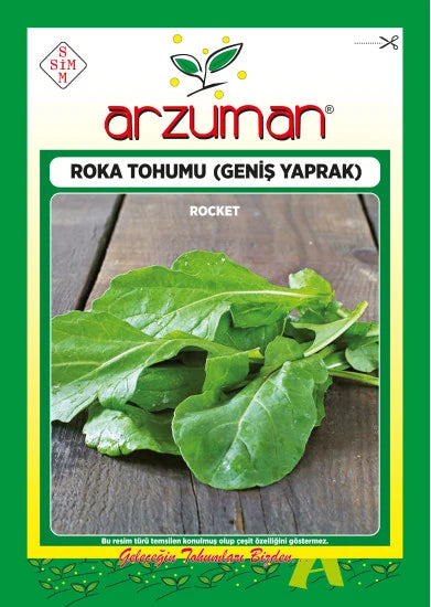 Arzuman geniş yapraklı roka tohumu paketi – ahşap tezgâh üzerinde duran iri ve oval yeşil roka yaprakları görseli