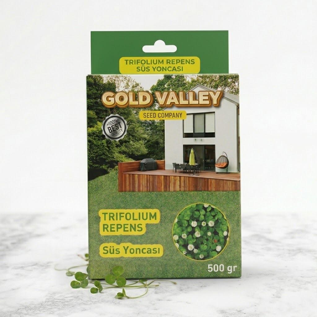 Gold Valley ak üçgül süs yoncası tohumu kutusu – ahşap çit ve yeşil örtü fotoğraflı 500 gramlık karton kutu ambalaj görseli